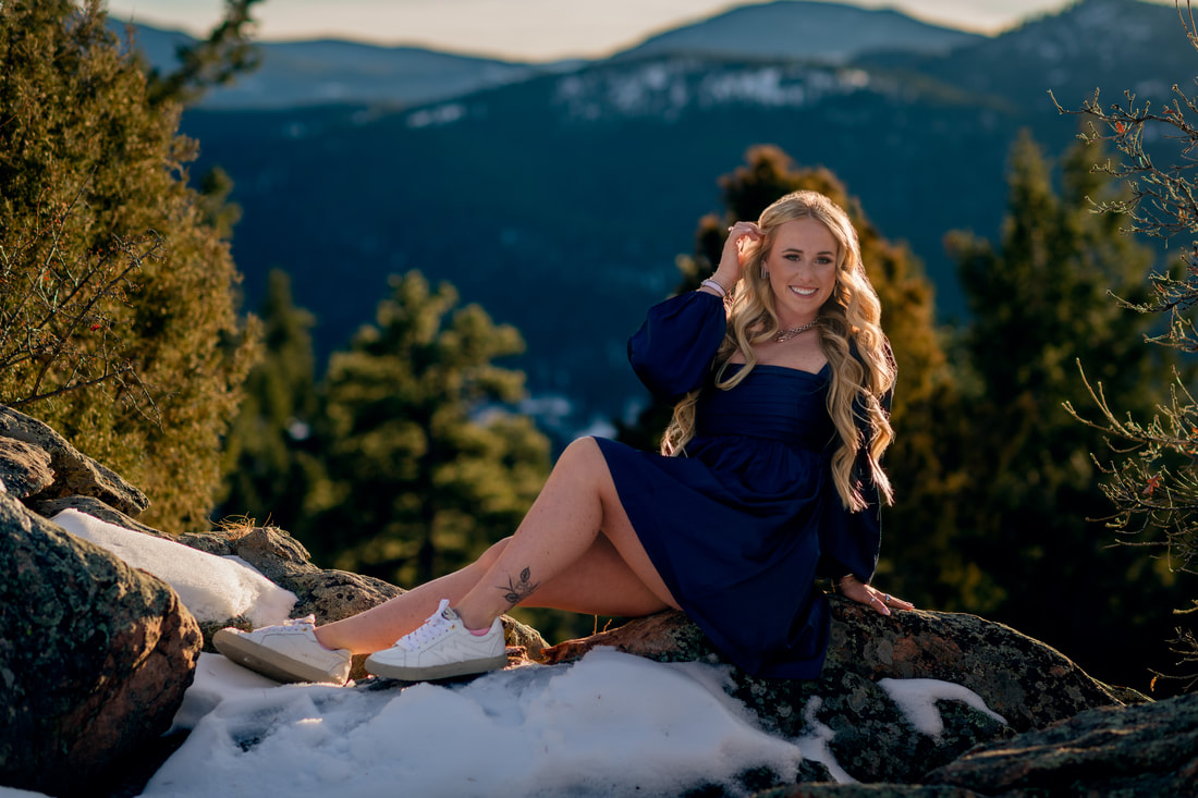 Girl in blue dress colorado rocky mountains with snow senior photoshoot 