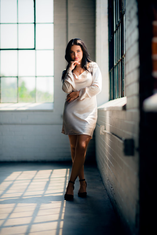 Girl in chic white dress in downtown Denver studio Senior Photoshoot